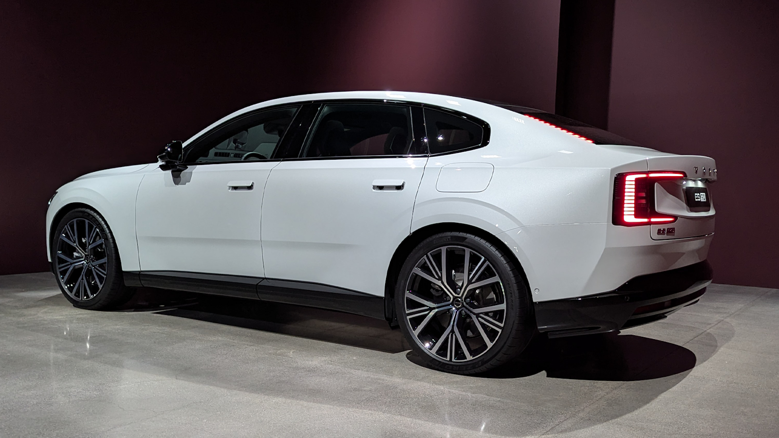 White Volvo ES90 from rear angle