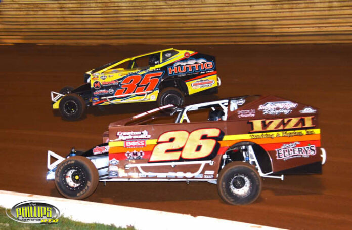 Sprint car racing on dirt track