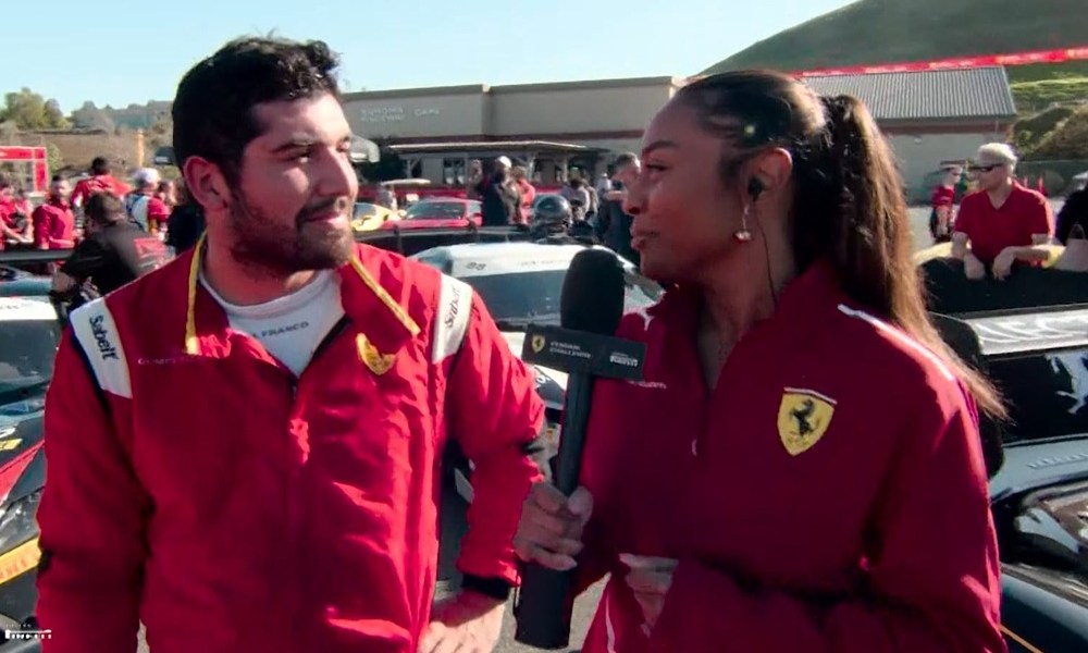 Reporter interviews Ferrari team member trackside